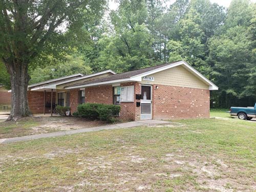 The side view of a brick housing unit.