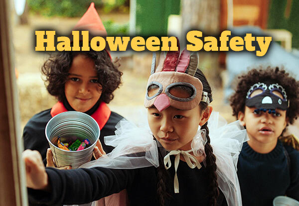 Three children trick-or-treating 