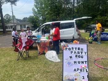 Kidsatatableattheposterpartyandeasteregghunt..jpg Kids at a table at the poster party and easter egg hunt.