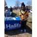 Man standing next to a table for Halifax Community College.