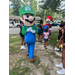  A person walking around in a Luigi costume. 