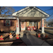  A front porch and yard decorated with gingerbread men decor. 